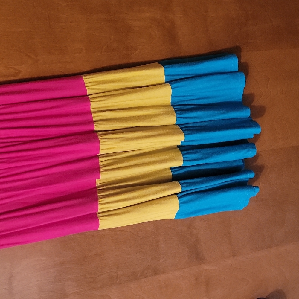 Size medium, bright color blocked, short jersey dress. Gently used. MCM brand.